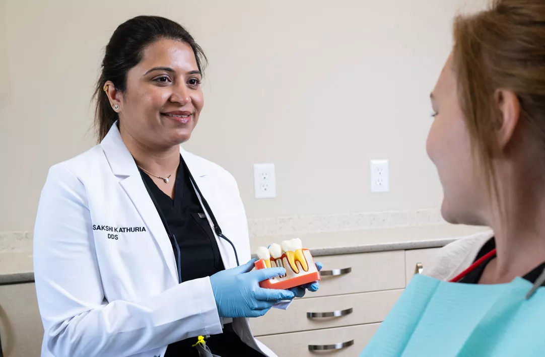 Dr. Kathuria explaining procedure to patient